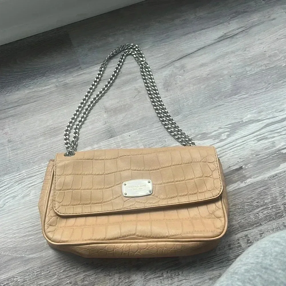 Tan Michael Kors envelope chain crossbody purse with adjustable straps